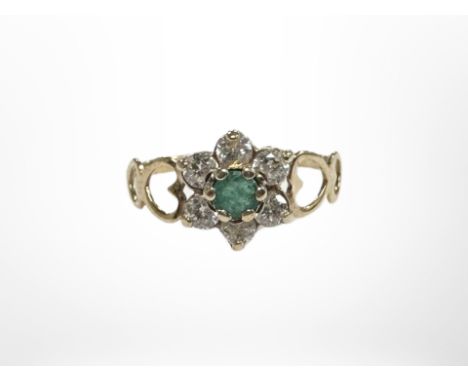 A 9ct gold CZ and emerald ring, size K.