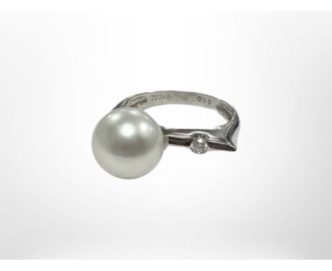 An 18ct white gold pearl and diamond ring.