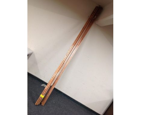 Fifteen lengths of copper pipe 