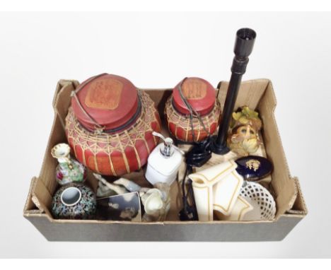 A box containing two wicker-bound storage boxes, a lamp base, Lladro figure of a boy reclining, ceramics, etc.