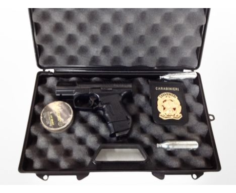 A Walther CP99 compact .177 calibre air pistol in carry cae with tin of pellets, two gas canisters and a replica Italian poli