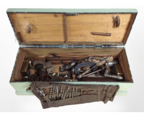 Four painted joiners tool boxes containing assorted hand tools, carpentry tools, files, vices etc 