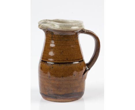 Richard Batterham (British, b. 1936) Jug with honey glaze and incised central band 19cm high. 