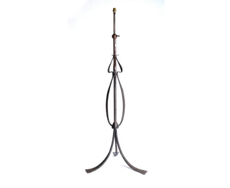 An Arts & Crafts steel and copper standard lamp of twisted form, with beaten finish 146cm high.