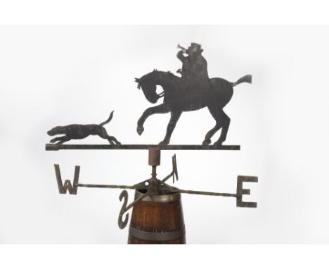 F Caswell & Son (Badsey, Evesham)  An iron weather vane depicting a huntsman on horseback with his hound length 109cm.