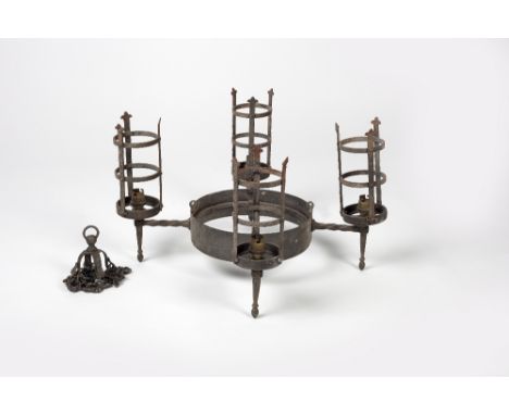 Arts & Crafts iron hanging lamp In the Gothic revival taste with four lights extending from a circular frame 56cm across.