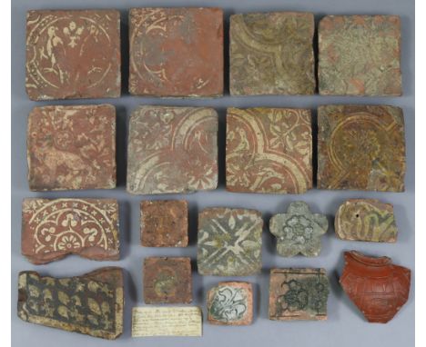 A COLLECTION OF MEDIEVAL TERRACOTTA FLOOR TILES comprising eight square tiles with encaustic decoration, 5” to 5½” wide; a di