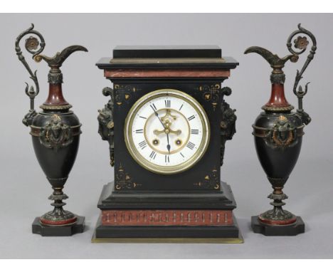 A 19th century French clock garniture in black slate &amp; rouge marble case with applied bronzed female masks to the sides, 