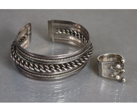 A Norwegian silver modernist ring by A. G. Eger, size: O/P, (9.4gm); &amp; a white metal stiff bangle with rope-twist borders