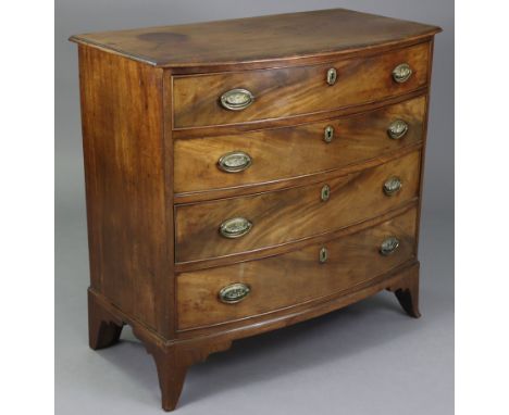 A George III mahogany bow-front chest, with moulded edge to the overhang top, fitted four long drawers with original brass ov