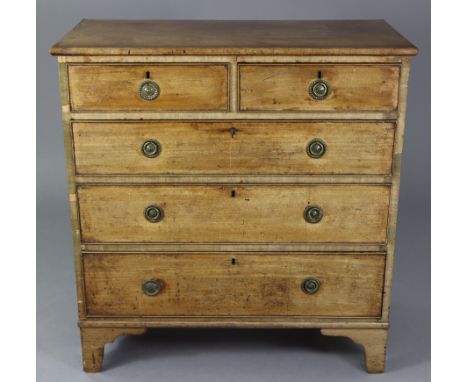 An early 19th century mahogany small chest, fitted two short &amp; three long graduated drawers with brass ring handles, on o