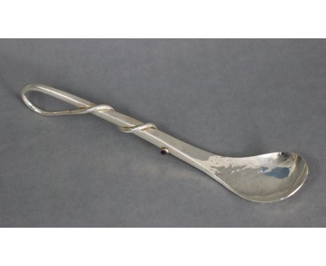 A Scottish silver preserve spoon with a spiralling whip handle inset amethyst cabochon to the tip, plain stem &amp; oval plan