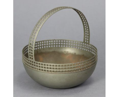 A German modernist plated circular basket dish in the style of Josef Hoffmann, with pierced rim &amp; overhang handle, on fla