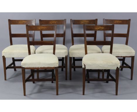 A set of six 19th century inlaid mahogany dining chairs, with oval marquetry shells to the ladder backs, with padded seats up