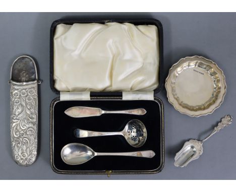 A silver set of sifter ladle, preserve spoon, &amp; butter knife, Sheffield 1937, by F. Cobb &amp; Co., in fitted case; an Ed