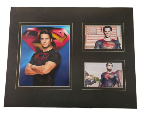 Henry Cavill signed colour photo with 2 unsigned colour photos as Superman. Mounted, measures 20x16 inch appx. Good condition