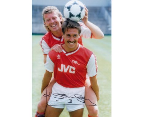 Autographed KENNY SANSOM 12 x 8 photo : Col, depicting Arsenal captain KENNY SANSOM posing with midfielder Graham Rix during 