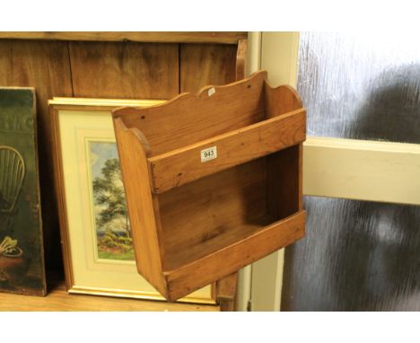 A vintage pine hanging spice rack