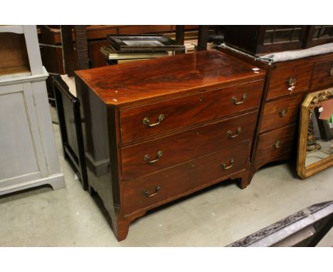 Early 19th century Mahogany Chest of Three Long Drawers with fluted canted corners, raised on bracket feet. h.87cms w.99cms