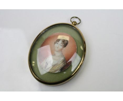 An early 19th century miniature portrait of a lady mounted in a later frame.