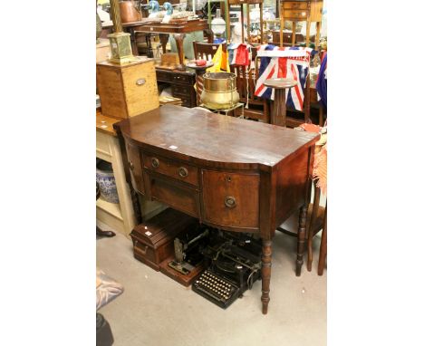 Regency Mahogany Bow Front Sideboard with an arrangement of four drawers, raised on turned ringed legs, h.89cms w.107cms