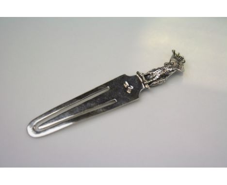 A silver bookmark with parrot finial
