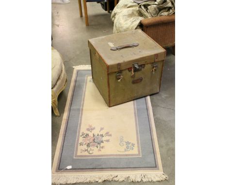 Early 20th century Canvas Trunk, L.56cms h.47cms together with a Cream and Blue Ground Rug, 80cms x 138cms