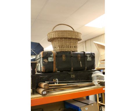 A metal tin trunk, a wooden bound trunk, wicker basket together with three croquet mallets, a fencing foil and mask