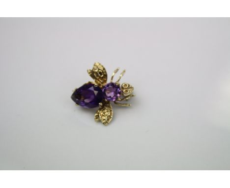 A vintage 14ct gold and amethyst bug brooch.