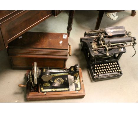 An early 20th century Remington Standard typewriter and a similar cased Singer sewing machine 