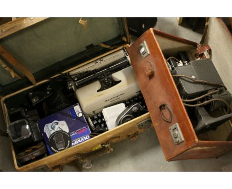 A mid 20th century Kodascope projector, a Rolliei slide projector and a labeled suitcase containing typewriter cine camera fi