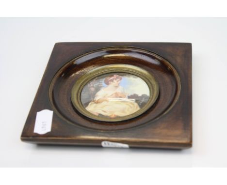 Miniature Portrait of a Child titled to verso ' L'innocence , signed J Reynolds, d.6cms, contained within a square wooden fra