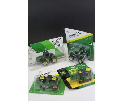 Four Ertl Diecast John Deere Agricultural Tractors - 9400 4WD Tractor, 9400T Tractor and Two 4WD Tractors, all contained with