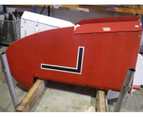 A De Havilland tail fin, red painted, approx 220 cm high, bearing Dove label inscribed "Type No. DHB/R/.... Serial No. DHB/GE