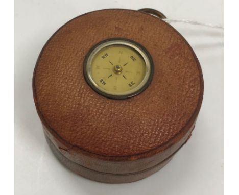 A F. Barker &amp; Sons London pocket barometer thermometer, the brushed steel dial bearing name, housed in a leather case, th