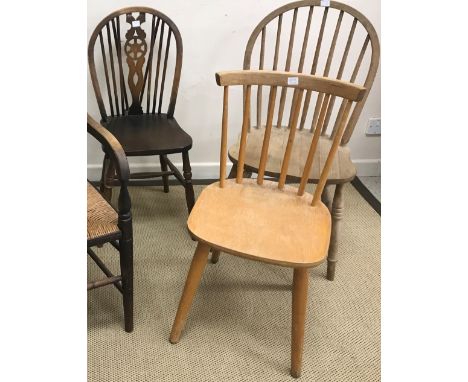 A collection of twelve various 19th and 20th Century chairs including rush seated ladder back elbow chair, stick back elbow c