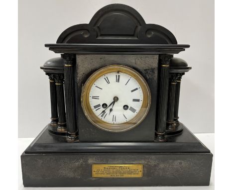 A circa 1900 black marble cased architectural mantle clock with column decoration and eight day French movement with circular