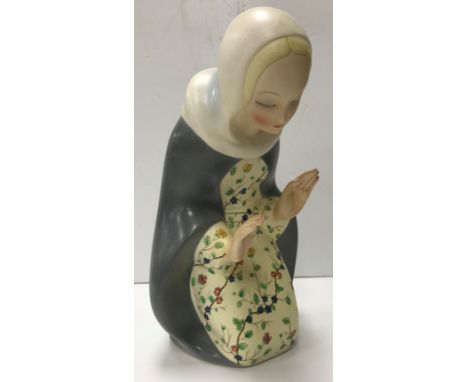 A Lenci pottery figure of the Madonna kneeling, her hands raised before her, signed to base 27.5 cm high