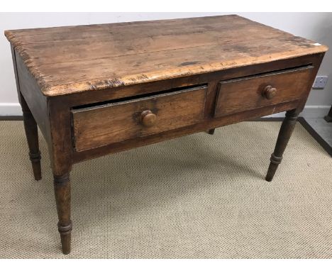 A 19th Century pine two drawer side table, on turned legs, 124 cm wide x 60 cm deep x 78 cm high