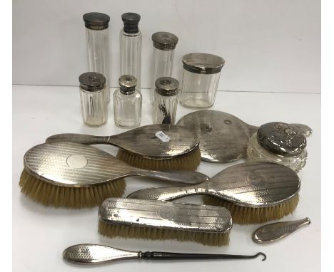 A collection of silver mounted dressing table bottles, hairbrushes etc (mainly Birmingham 1911 by Synyer &amp; Beddoes)