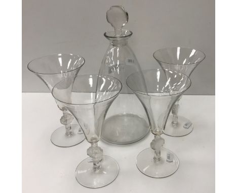 A Lalique "Barr" decanter signed and No'd 5005 to base 25.5 cm high together with a set of four matching wine glasses No'd 50