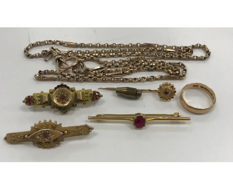 A collection of 9 carat gold comprising three Victorian and later bar brooches with red stone and pearl set, a similar scarf/