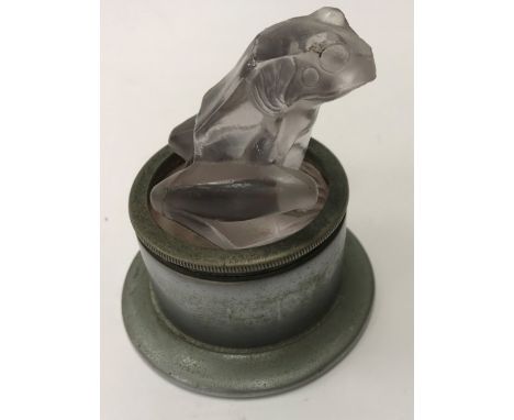 A René Lalique "Grenouille" car mascot as a seated frog, inscribed around base "R Lalique France" on a plated mount inscribed