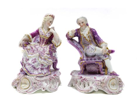 A pair of John Bevington figural three light candelabra, 19th century, woman playing a hurdy gurdy and peep show man after Me
