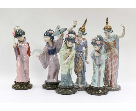 A group of six Asian Lladro figures, including a pair of Thai dancing figures (model no - A 23 MY, A 19 MY), together with a 