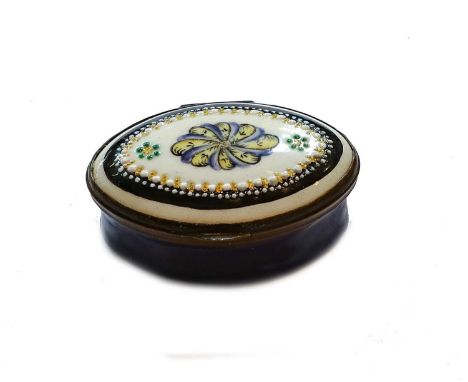 An 18th century South Staffordshire enamel patch box of navette form, blue-ground, the cover painted with a geometric design