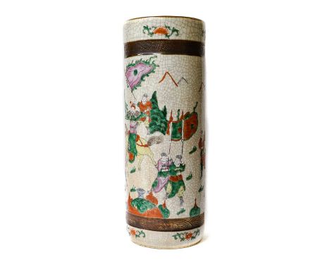 An early 20th century Chinese crackle glazed cylindrical stick stand, painted in famille verte enamels with a procession of f