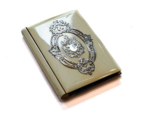 A Silver and Enamel-Mounted Ivory Wallet, First Quarter 20th Century, oblong, the cover applied with foliage scrolls, the int