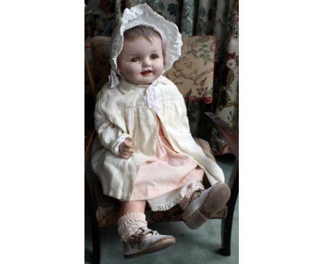 A reliable doll, Canadian 1930's. A large painted composition head baby doll with sleeping eyes. Moulded hair, domed head, op