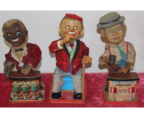 Three vintage battery operated Tin Toys. Including Mr Mc Gregor, smoking cigar, with hard vinyl head marked: TN, made in Japa